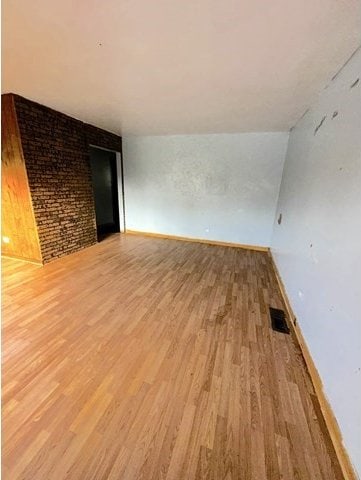 unfurnished room with light hardwood / wood-style floors