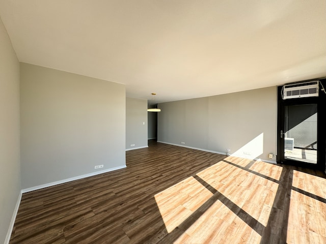 unfurnished room featuring dark hardwood / wood-style floors