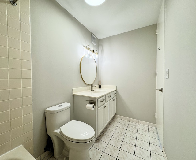 bathroom with vanity, tile patterned floors, and toilet