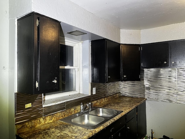 kitchen with sink and decorative backsplash