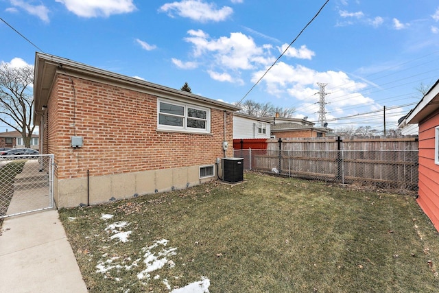 view of home's exterior featuring a lawn and central air condition unit