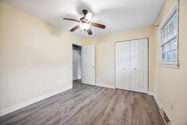 unfurnished bedroom featuring a closet, ceiling fan, and light hardwood / wood-style floors