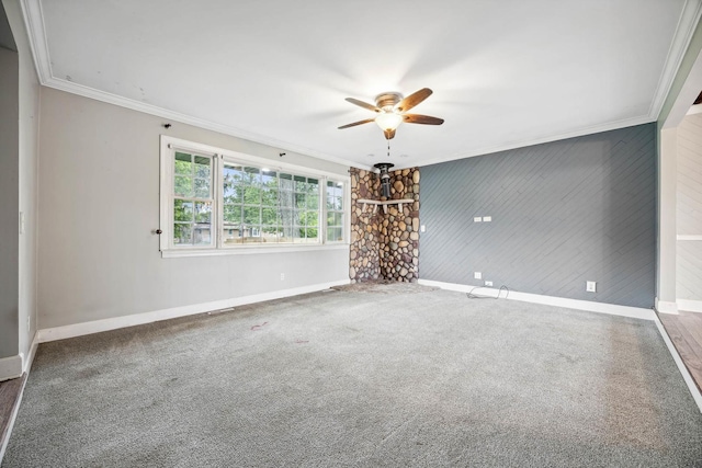 unfurnished room featuring ceiling fan, carpet, and crown molding