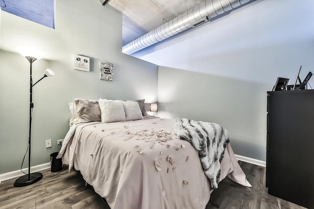 bedroom with hardwood / wood-style flooring