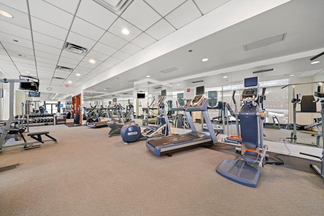 workout area with a drop ceiling and carpet