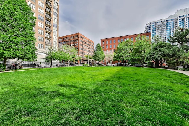 view of property's community featuring a lawn