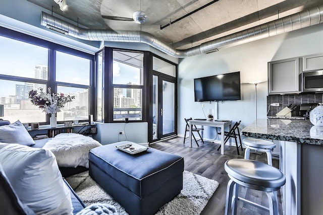 living room with dark wood-type flooring