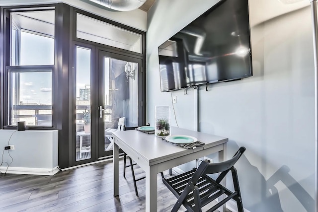 dining area featuring dark hardwood / wood-style floors