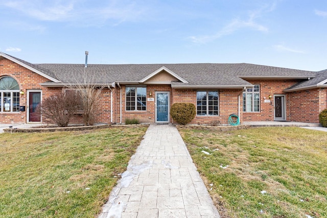 ranch-style home with a front lawn