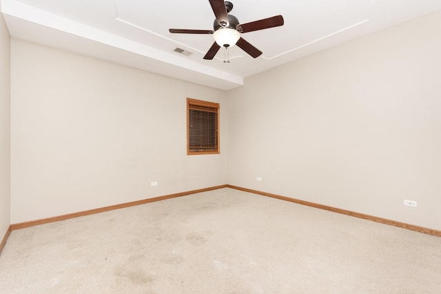 spare room with carpet flooring and ceiling fan