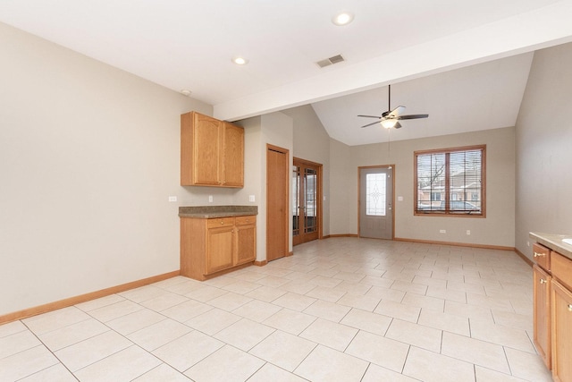 kitchen with lofted ceiling, light tile patterned floors, and ceiling fan