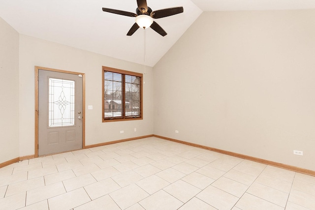 tiled entryway with ceiling fan and high vaulted ceiling