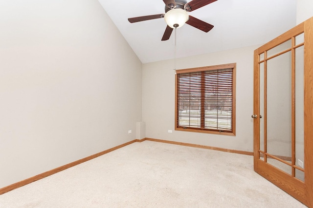 unfurnished bedroom with vaulted ceiling, light colored carpet, ceiling fan, and a closet