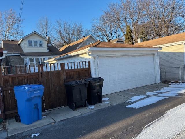 view of side of property with a garage