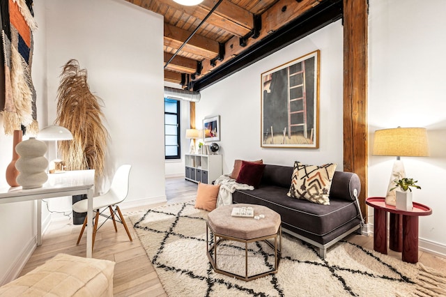 living room featuring wooden ceiling, light hardwood / wood-style floors, and beamed ceiling