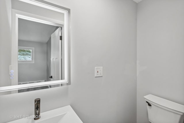 bathroom with sink and toilet