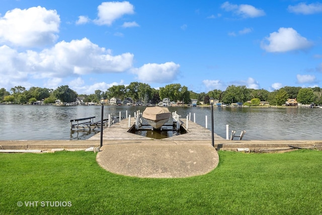 dock area featuring a water view and a yard