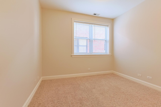 spare room with carpet