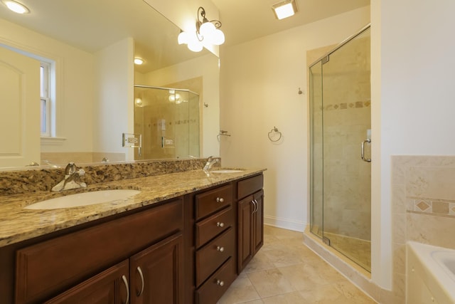 bathroom with vanity, tile patterned floors, and shower with separate bathtub