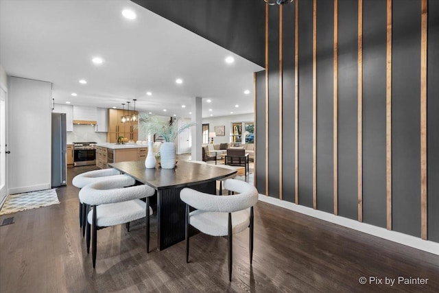 dining room with visible vents, dark wood-style flooring, and recessed lighting