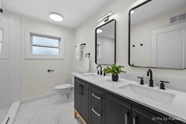 bathroom featuring marble finish floor, visible vents, a sink, and toilet