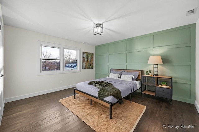 bedroom featuring dark hardwood / wood-style flooring