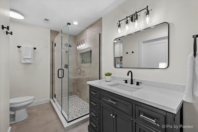 bathroom with vanity, an enclosed shower, tile patterned floors, and toilet