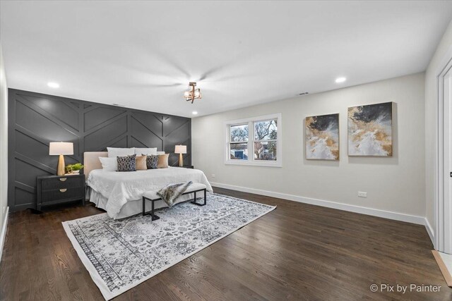 bedroom with dark wood-type flooring