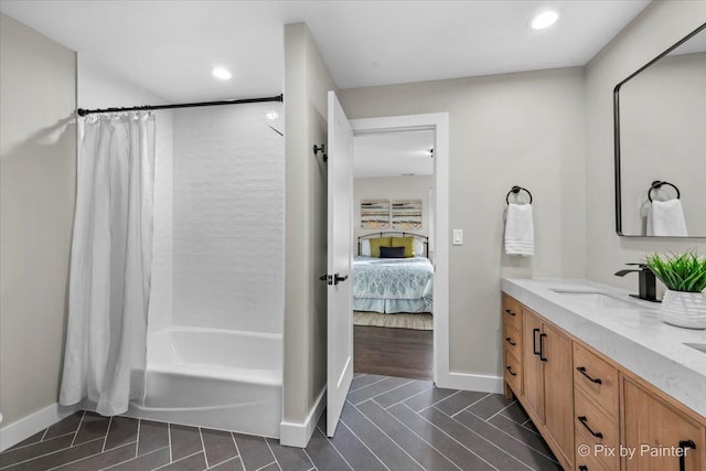 bathroom with shower / tub combo with curtain and vanity