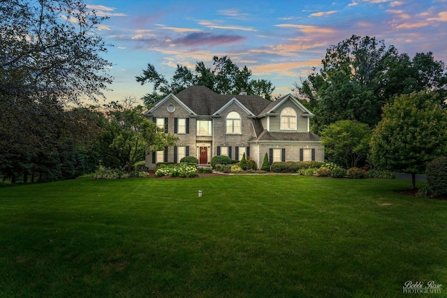 view of front of property with a lawn