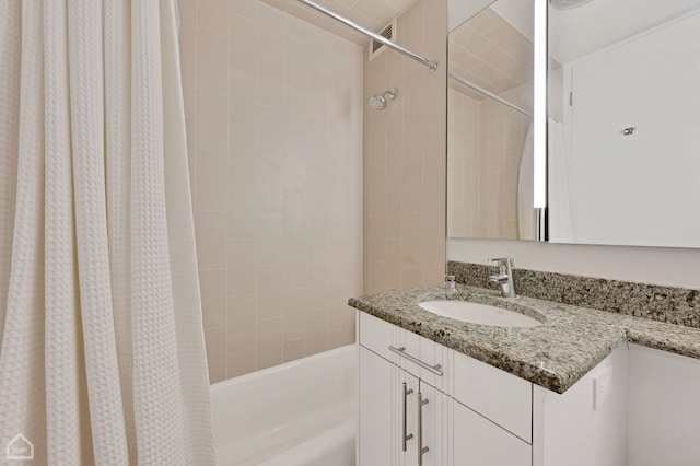 bathroom featuring vanity and shower / bath combo with shower curtain