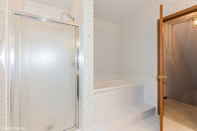 full bath featuring a stall shower, tile patterned flooring, a bath, and wallpapered walls