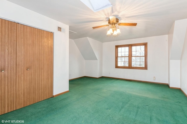 additional living space with a ceiling fan, carpet, visible vents, and baseboards