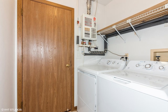 laundry room with laundry area and washing machine and clothes dryer