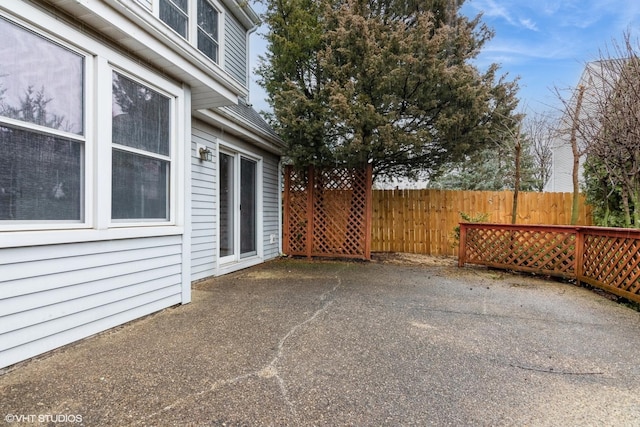 view of patio / terrace featuring fence