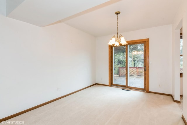 empty room featuring a chandelier, visible vents, light carpet, and baseboards