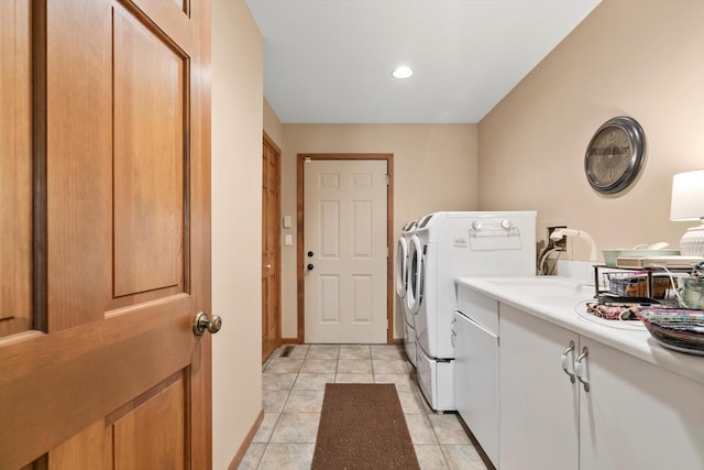 laundry area featuring sink, cabinets, washing machine and dryer, and light tile patterned floors