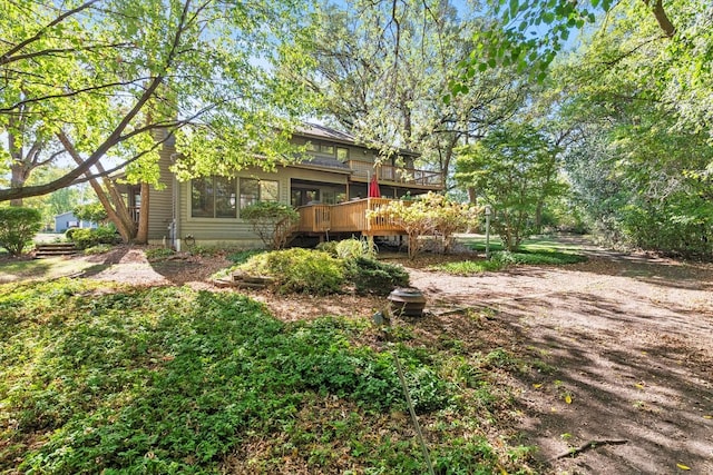 view of yard featuring a wooden deck