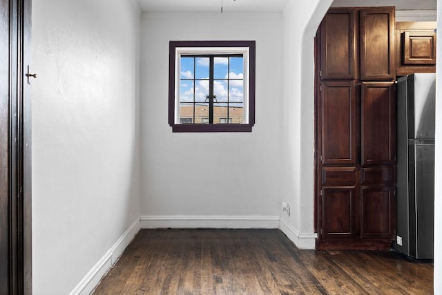 unfurnished dining area with dark hardwood / wood-style flooring