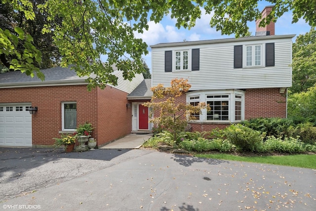 view of front of property with a garage