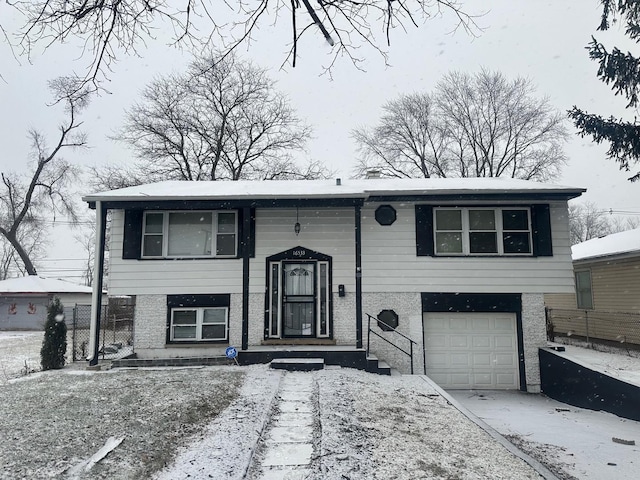 bi-level home featuring a garage