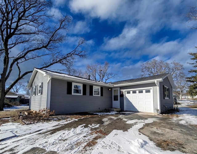 single story home featuring a garage