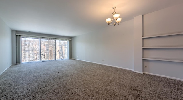 unfurnished living room with a notable chandelier and carpet flooring