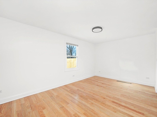 unfurnished room featuring light hardwood / wood-style floors