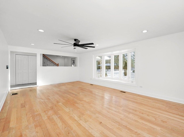 spare room featuring ceiling fan and light wood-type flooring