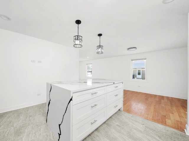 interior space featuring a healthy amount of sunlight and light hardwood / wood-style floors