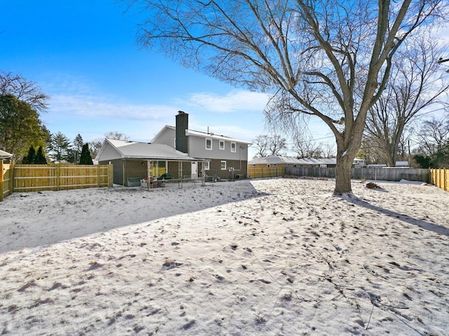 view of snow covered house