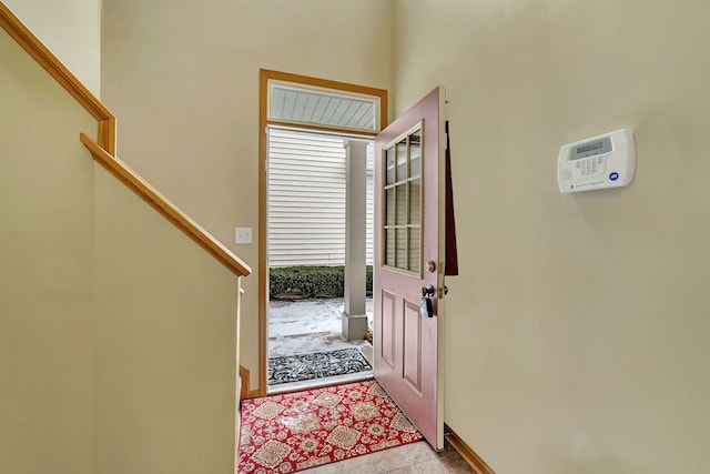 entryway featuring light tile patterned floors