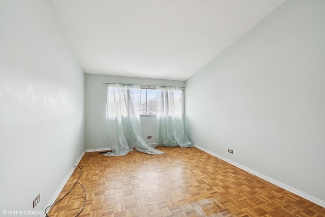 unfurnished room featuring light parquet floors