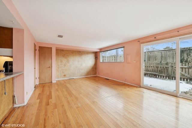 unfurnished living room featuring light hardwood / wood-style flooring